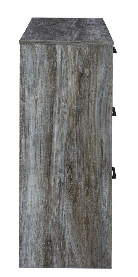 Close-up of antiqued gunmetal-tone linear handle on dresser