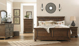 Flynnter Medium Brown Queen Panel Bed - Ella Furniture