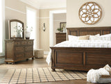 Flynnter Medium Brown King Panel Bed - Ella Furniture