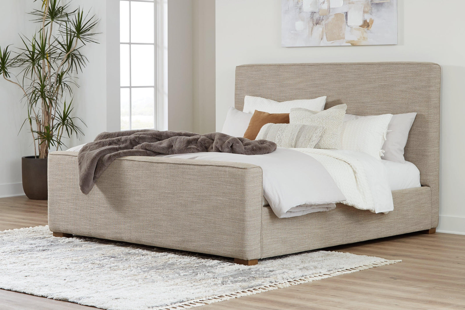Dakmore Brown Queen Upholstered Bed - Ella Furniture