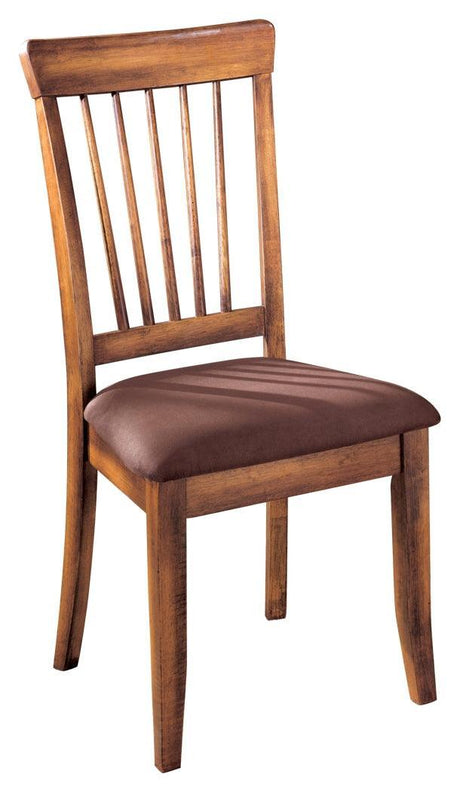 Two Berringer Brown Upholstered Wood Dining Chairs paired at a dining table