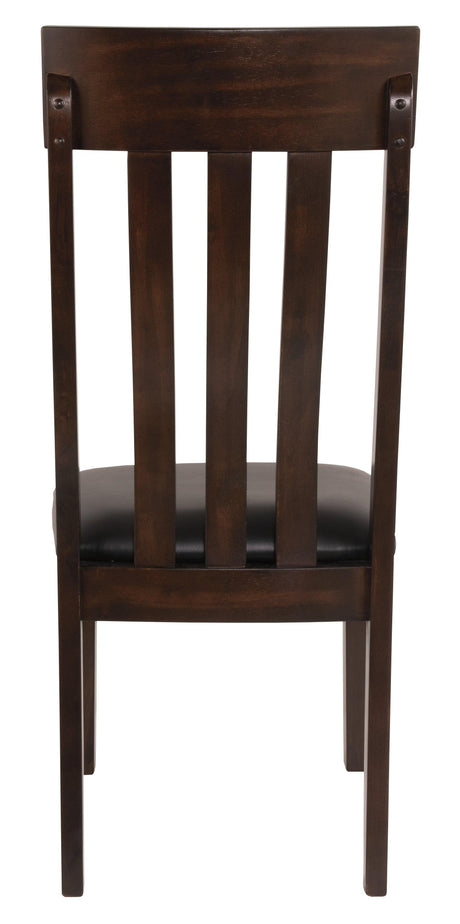 Haddigan dining chair side angle focusing on padded seat and curved back
