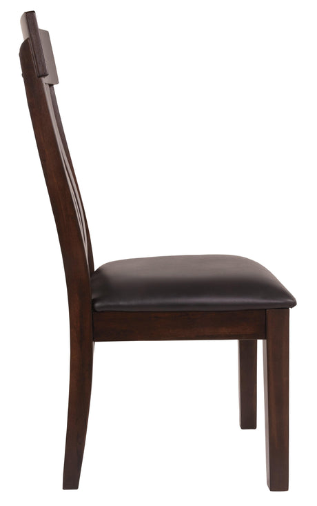 Close-up of Haddigan chair tufted faux leather seat and wood frame