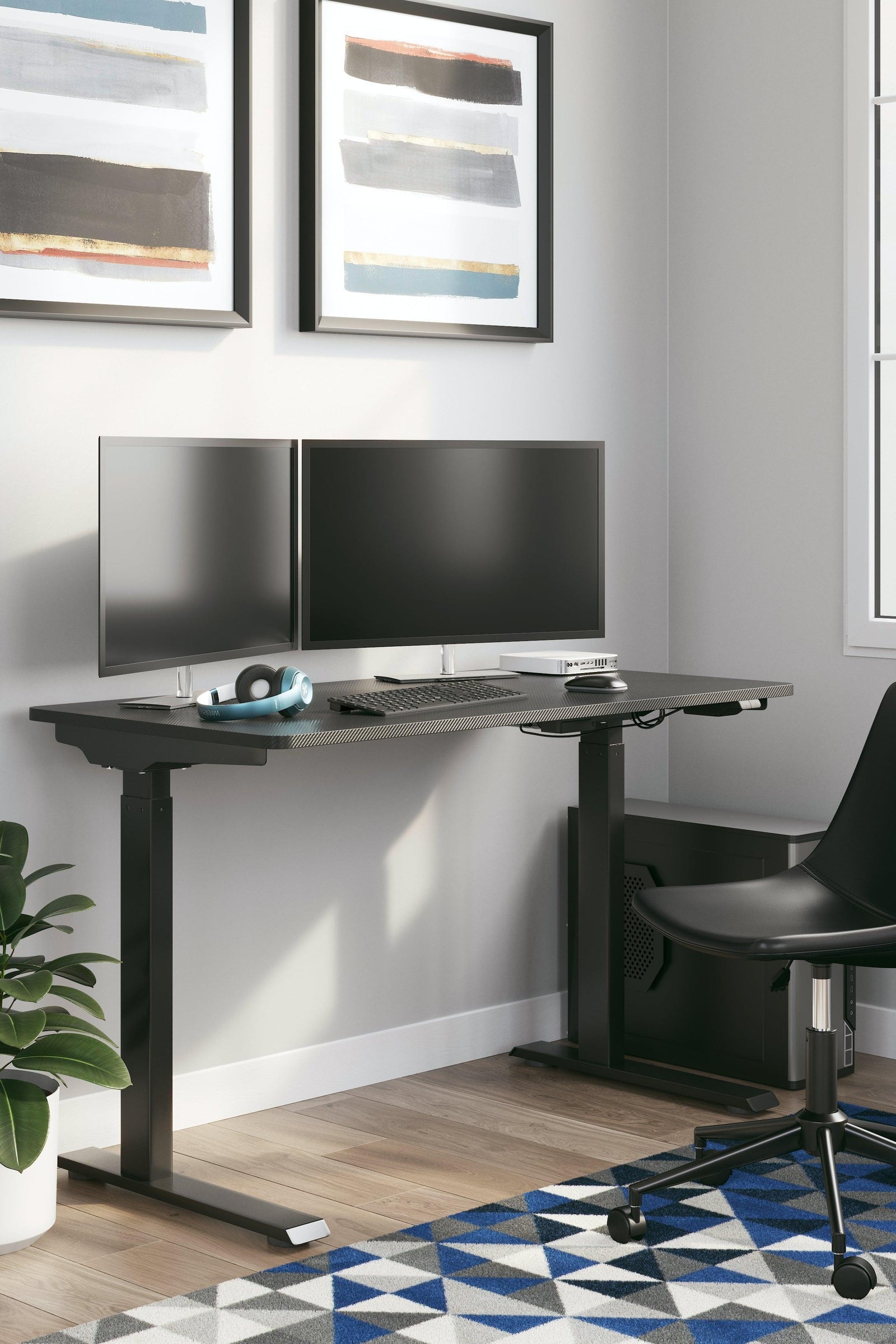 Lynxtyn Black Adjustable Height Home Office Desk - Ella Furniture