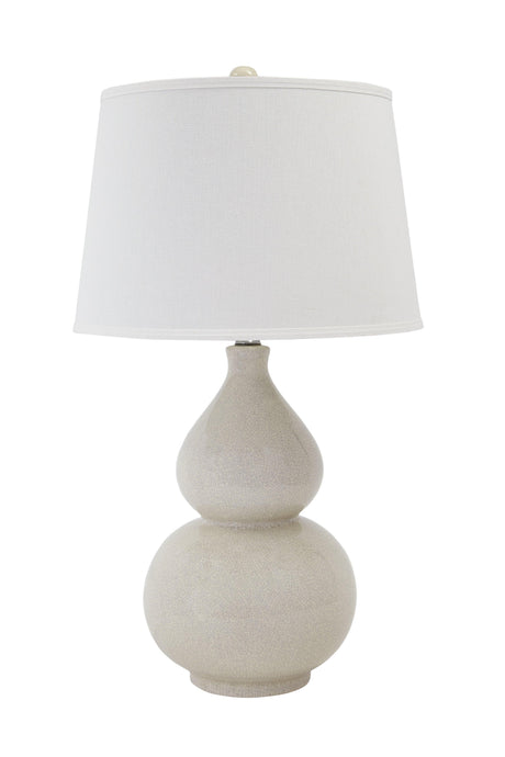 Side angle of Saffi cream ceramic table lamp highlighting drum shade