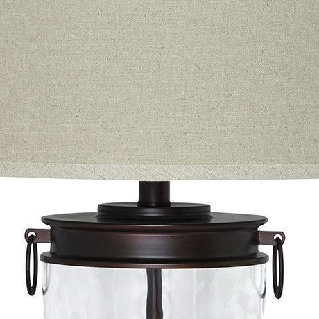Tailynn table lamp close-up on fabric drum shade and bronze hardware