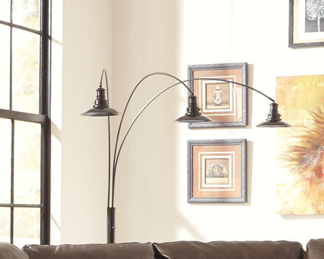 Sheriel Black Metal Arc Floor Lamp in a styled contemporary living space