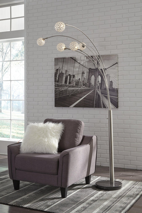 Close-up of Winter Arc Floor Lamp black marble base and silver arc