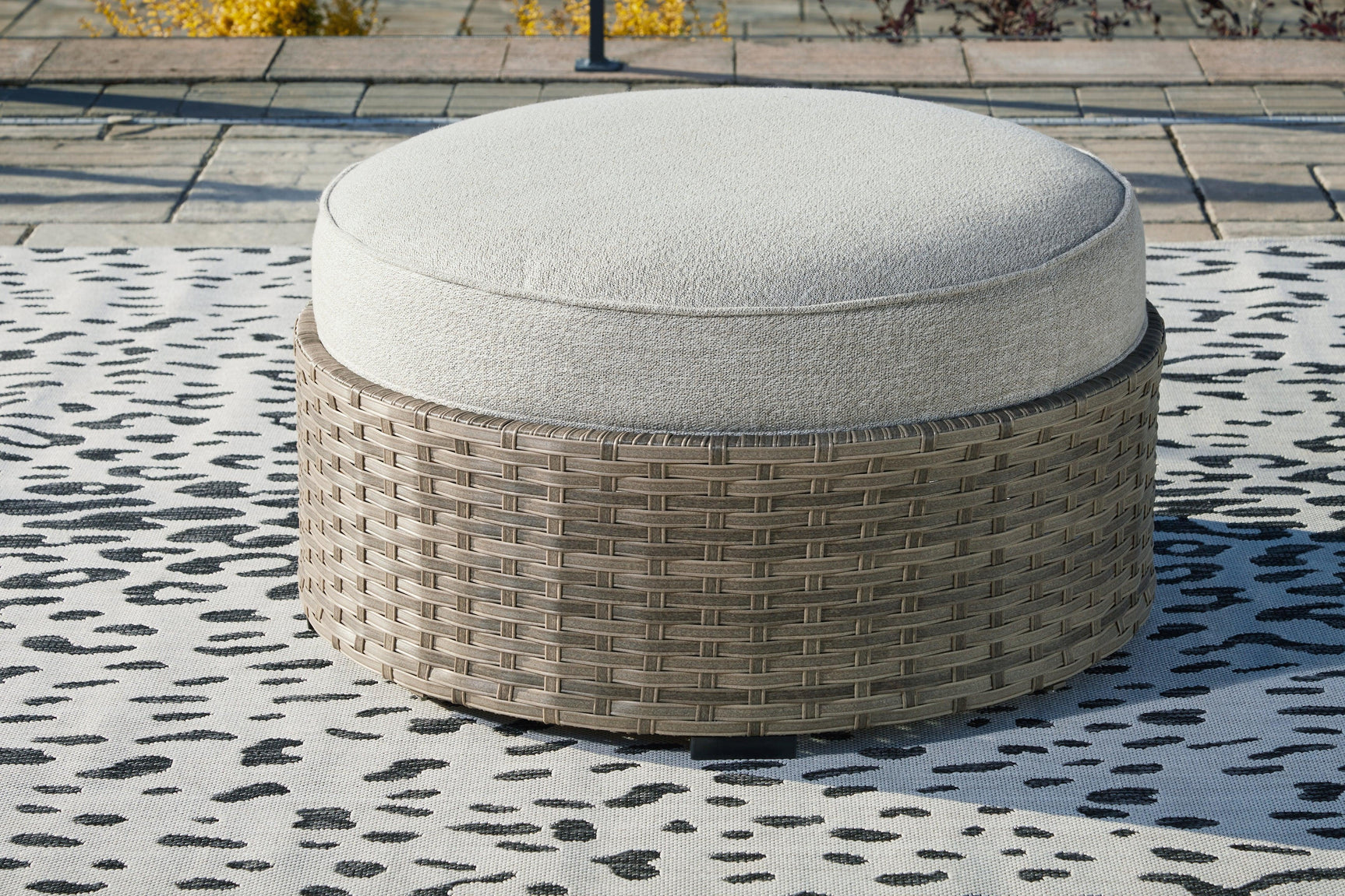 Calworth Beige Outdoor Ottoman With Cushion - Ella Furniture