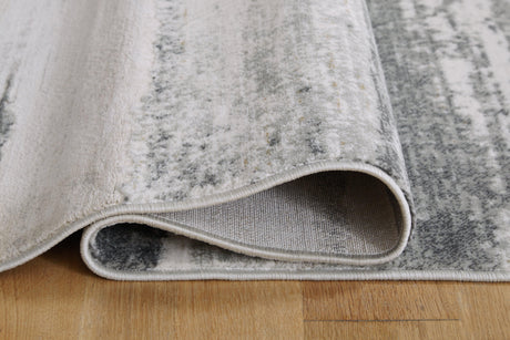 Abanett Multi 7'10" X 10'2" Rug - Ella Furniture