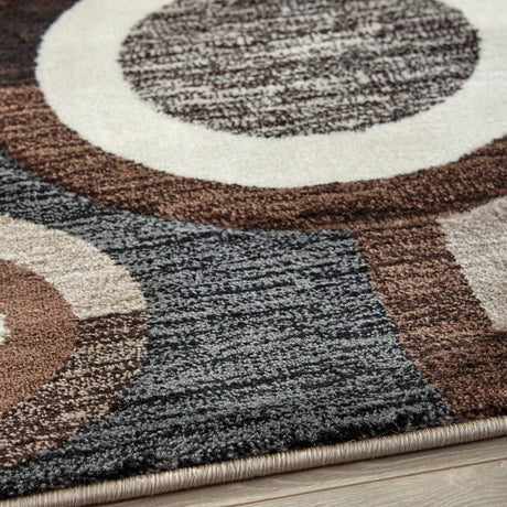 Close-up of Guintte Multi geometric design and pile texture on area rug